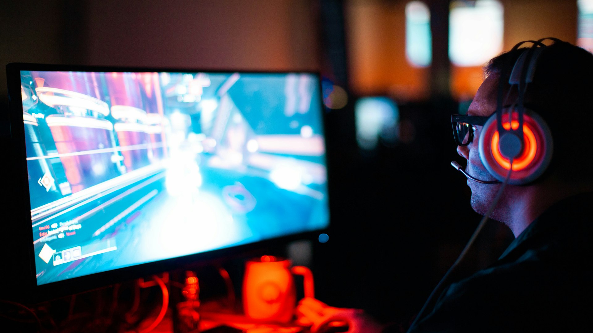 Retro arcade cabinets glowing in a neon-lit gaming lounge